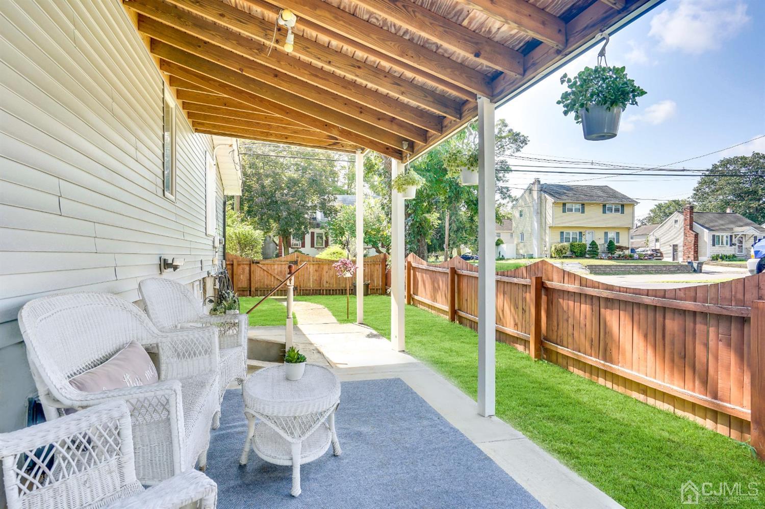 254 Manalapan Road Spotswood, NJ 08884 - Photo 29 of 41 a view of a patio with couches chairs and a backyard