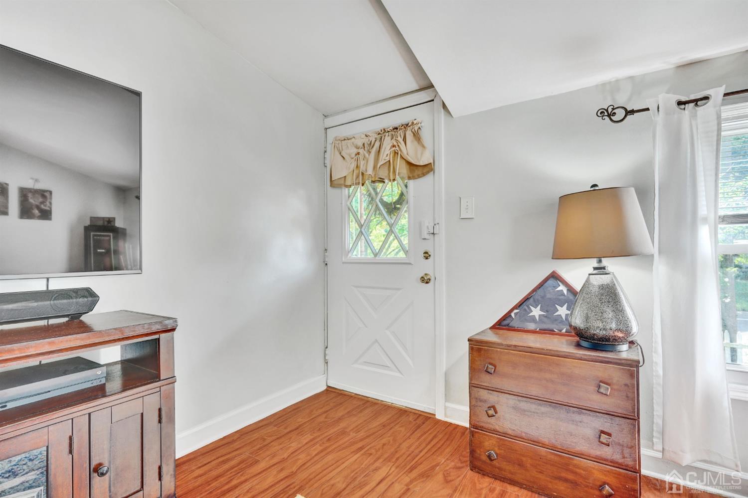254 Manalapan Road Spotswood, NJ 08884 - Photo 4 of 41 a bedroom with a bed and a dresser