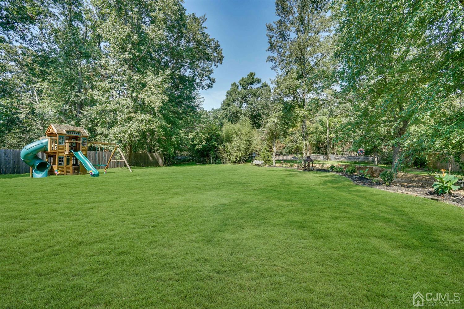 254 Manalapan Road Spotswood, NJ 08884 - Photo 32 of 41 a view of a garden with a slide