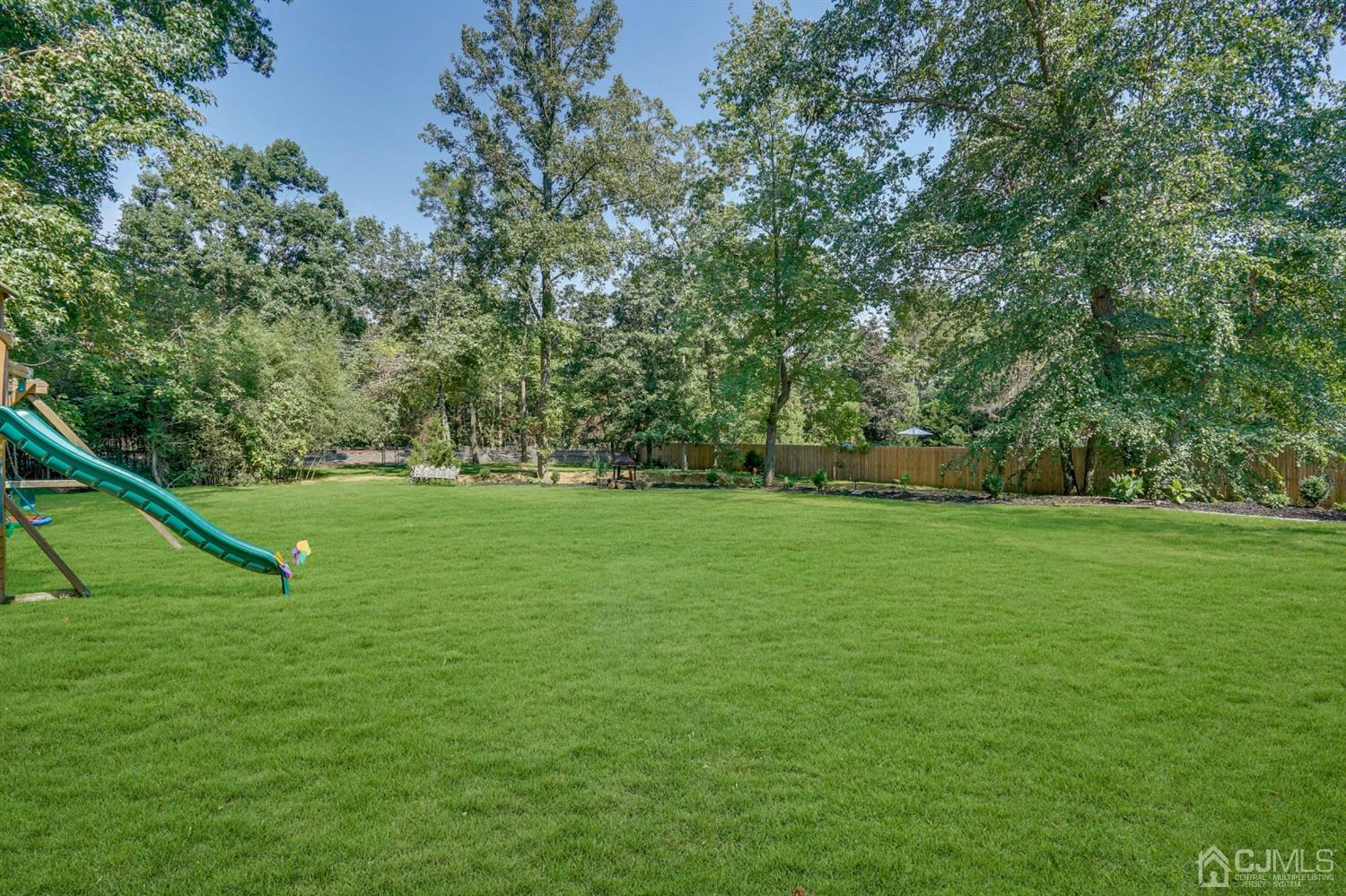 254 Manalapan Road Spotswood, NJ 08884 - Photo 34 of 41 a view of field with tall trees