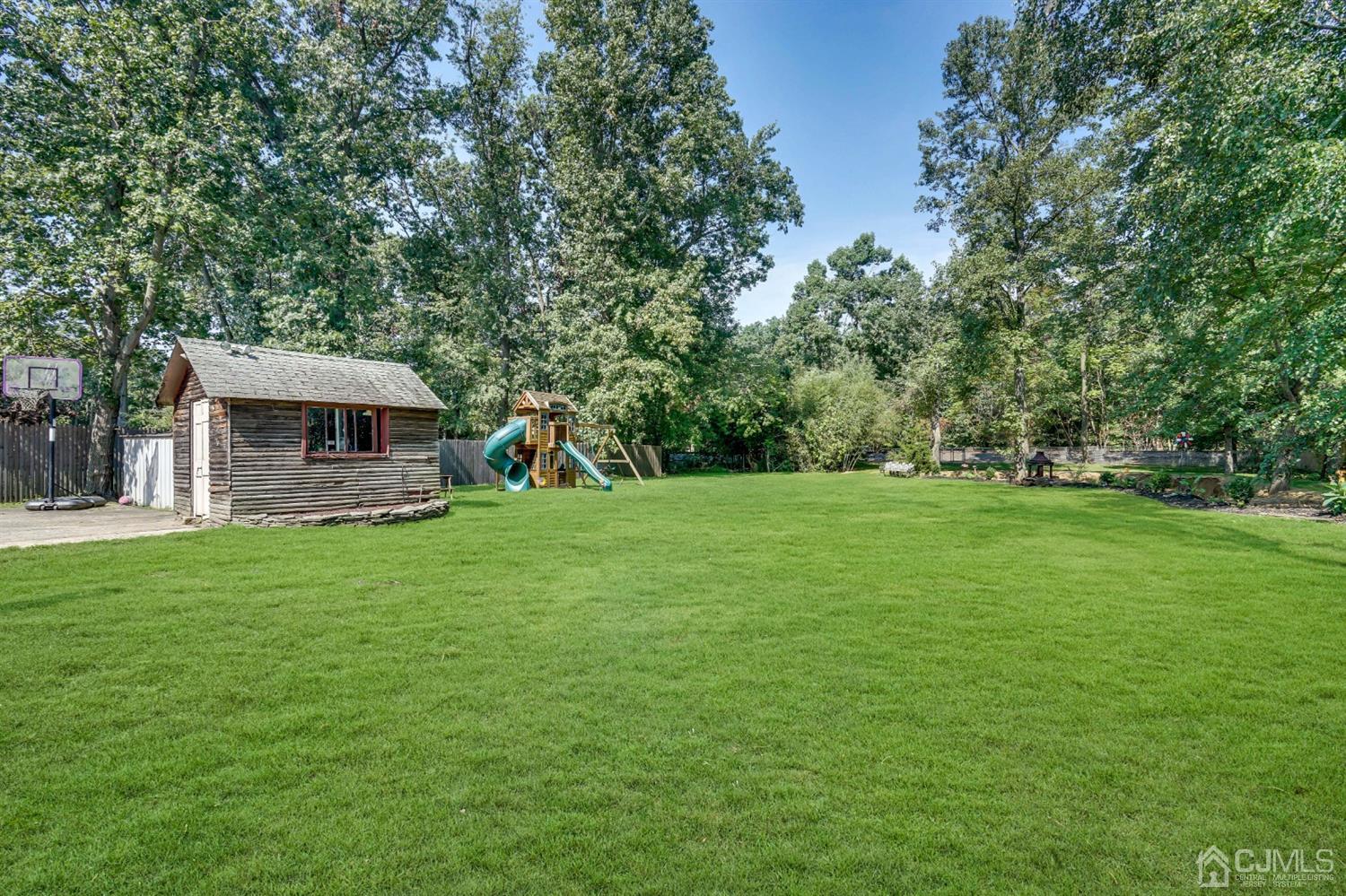 254 Manalapan Road Spotswood, NJ 08884 - Photo 35 of 41 a view of a house with backyard