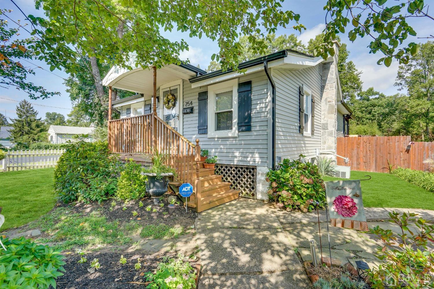 254 Manalapan Road Spotswood, NJ 08884 - Photo 39 of 41 a front view of a house with garden