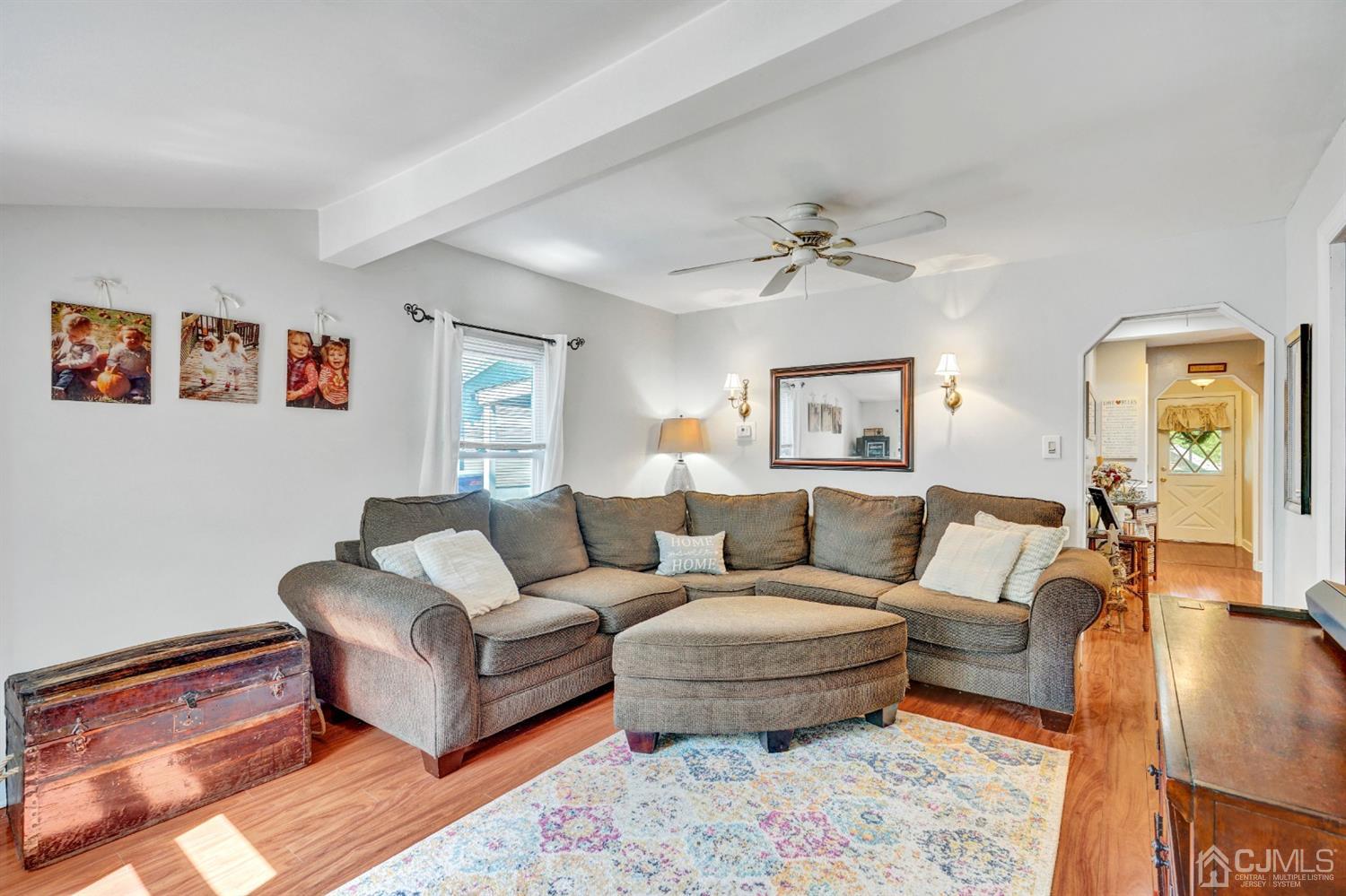 254 Manalapan Road Spotswood, NJ 08884 - Photo 5 of 41 a living room with furniture and a walk in closet