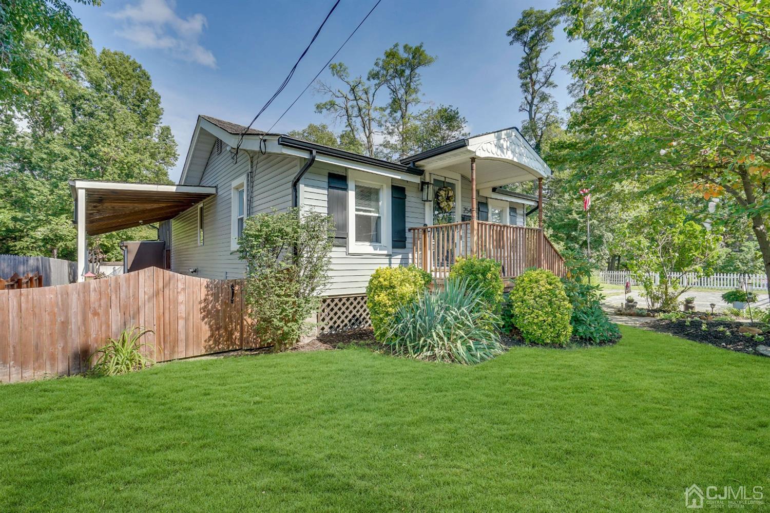 254 Manalapan Road Spotswood, NJ 08884 - Photo 41 of 41 a front view of a house with garden