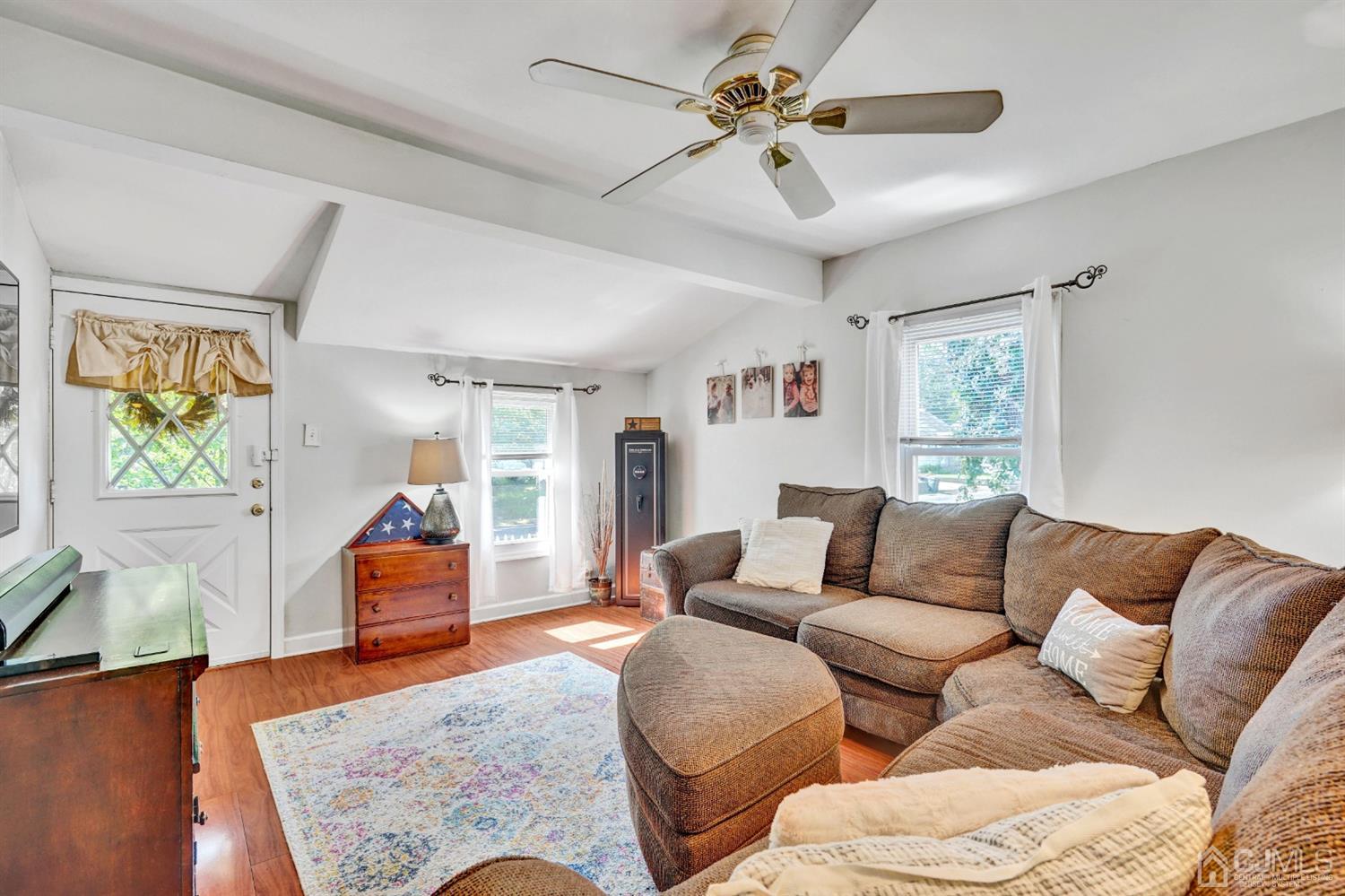 254 Manalapan Road Spotswood, NJ 08884 - Photo 7 of 41 a living room with furniture and a large window
