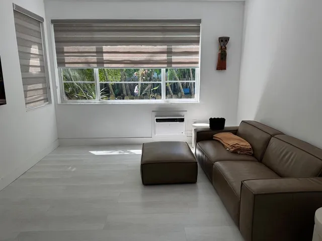 a room with furniture and air hockey table