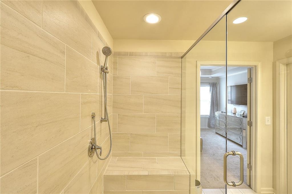 1306 Harris Way South Atlanta, GA 30319 - Photo 11 of 19 a bathroom with a shower and a glass door