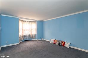 1618 Roundhill Road Baltimore, MD 21218 - Photo 5 of 50 an empty room with a empty space and a window