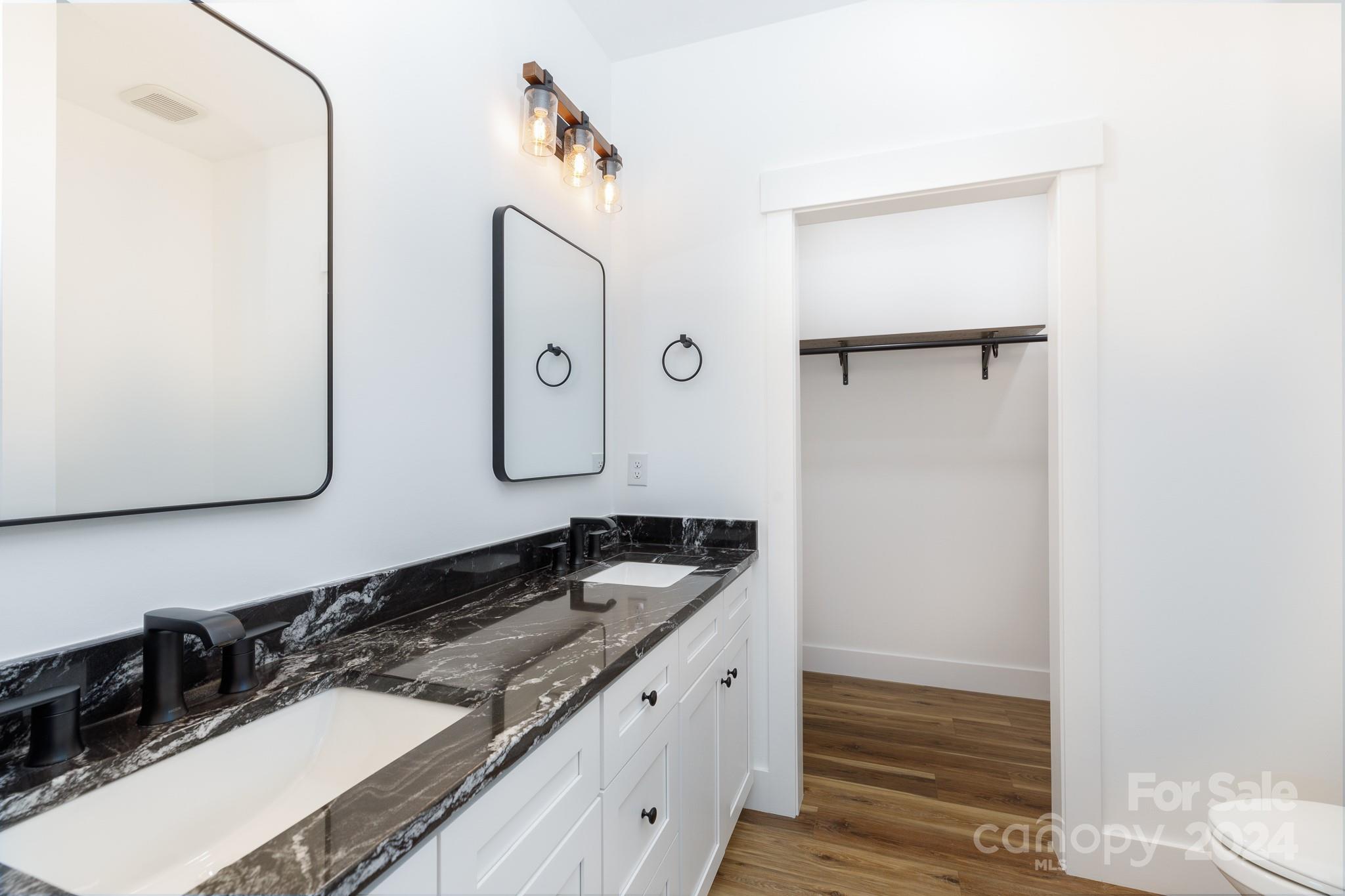 5040 Mt Gallant Road Rock Hill, SC 29732 - Photo 19 of 38 a bathroom with a granite countertop sink and a mirror