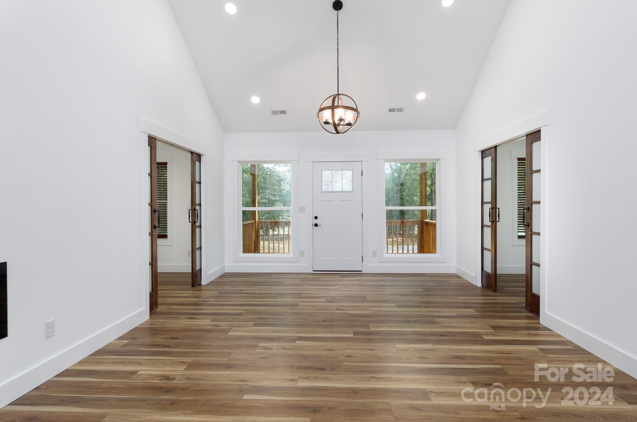 5040 Mt Gallant Road Rock Hill, SC 29732 - Photo 2 of 38 a view of an empty room with wooden floor and a window