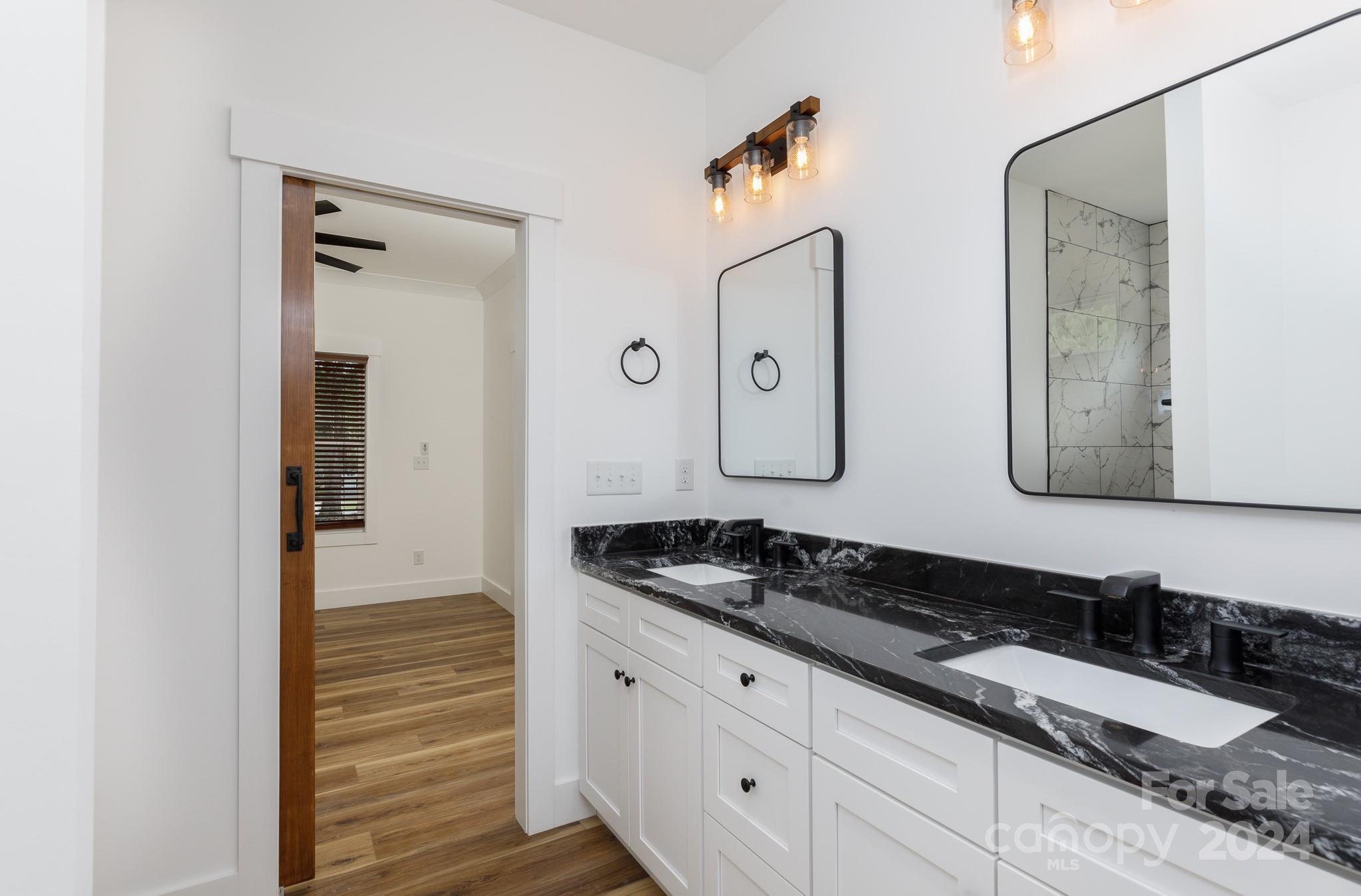 5040 Mt Gallant Road Rock Hill, SC 29732 - Photo 21 of 38 a bathroom with a granite countertop sink and a mirror