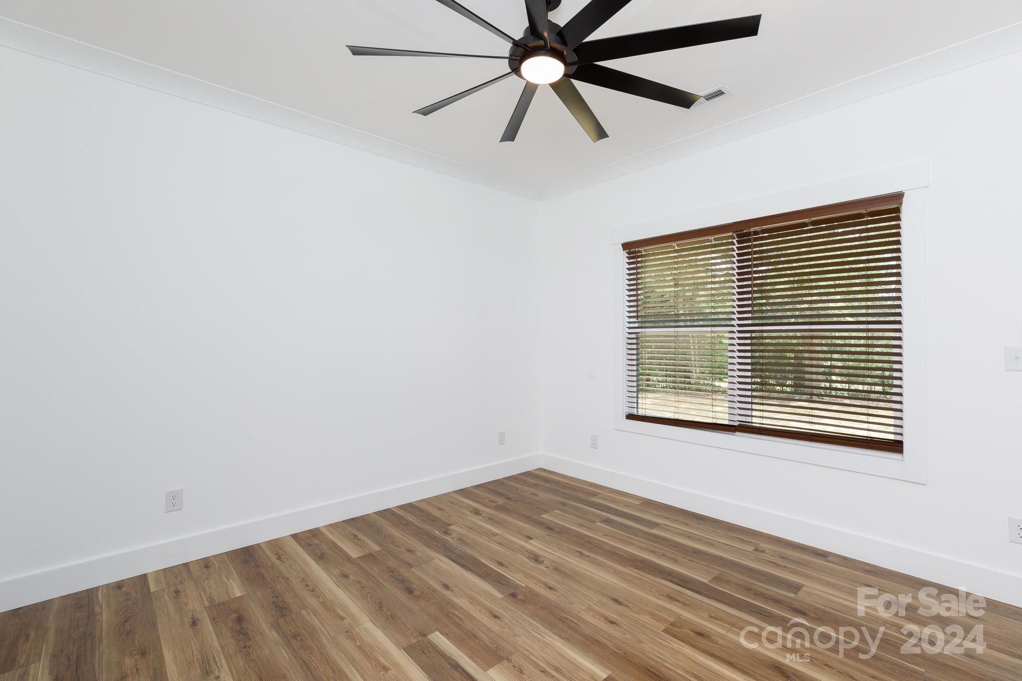 5040 Mt Gallant Road Rock Hill, SC 29732 - Photo 25 of 38 a view of an empty room with wooden floor and a window
