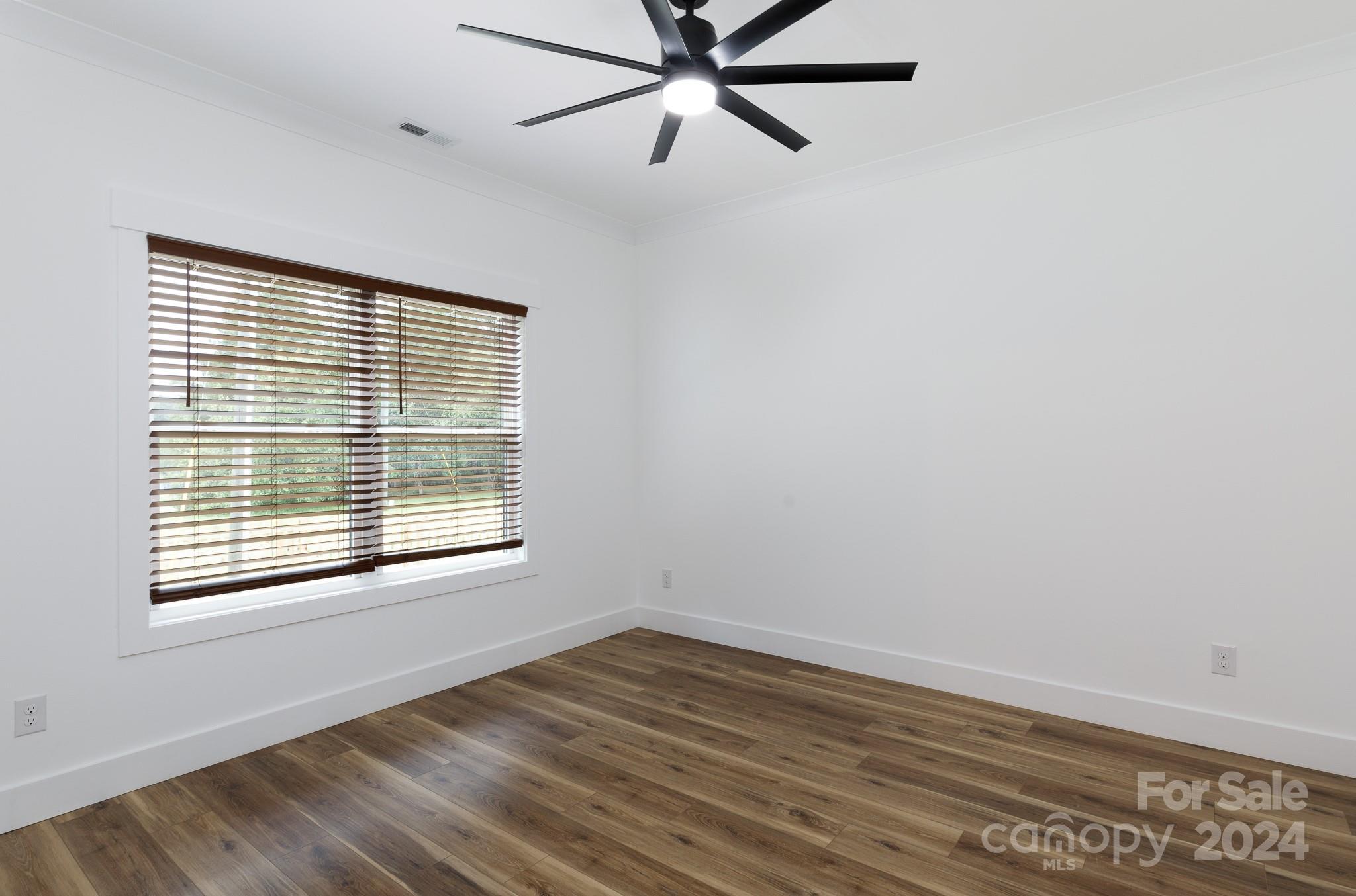 5040 Mt Gallant Road Rock Hill, SC 29732 - Photo 26 of 38 a view of an empty room with wooden floor and a window
