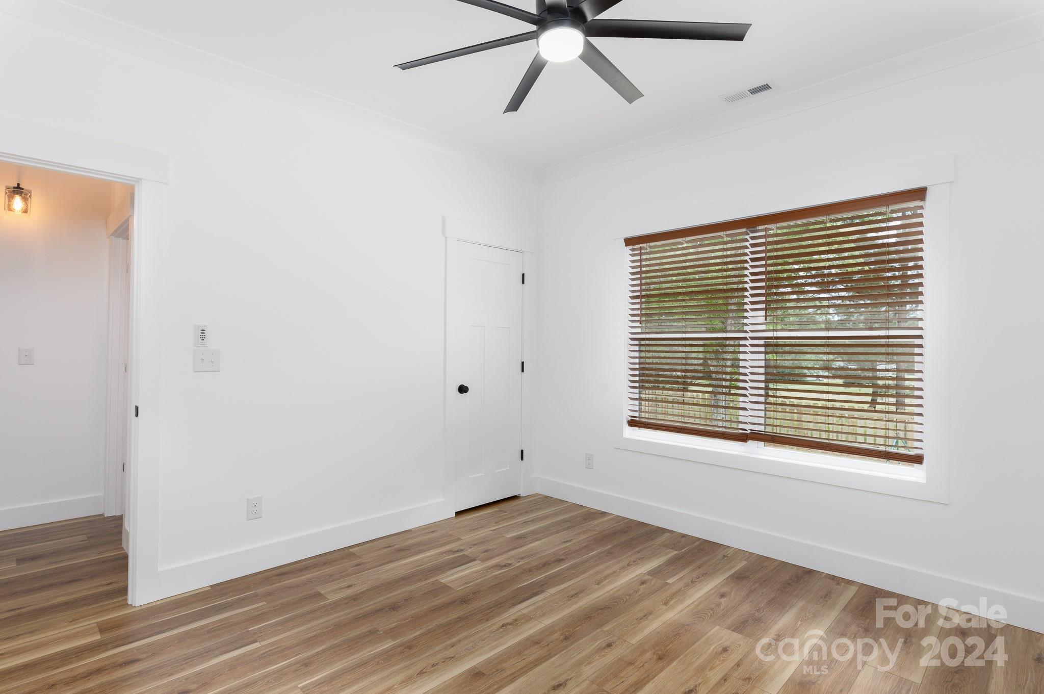 5040 Mt Gallant Road Rock Hill, SC 29732 - Photo 27 of 38 a view of an empty room with wooden floor and a window