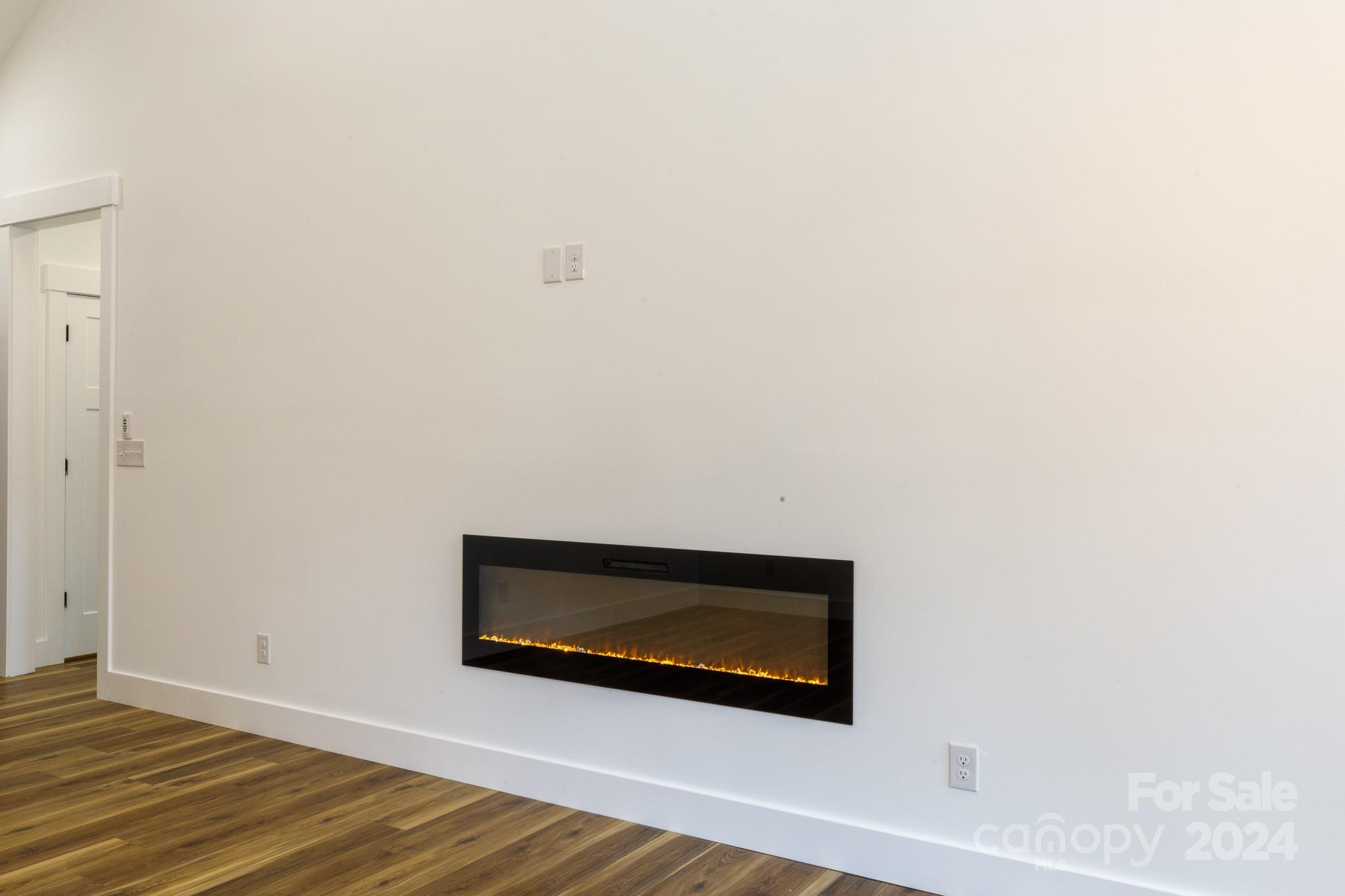5040 Mt Gallant Road Rock Hill, SC 29732 - Photo 6 of 38 a view of hallway with wooden floor and tv