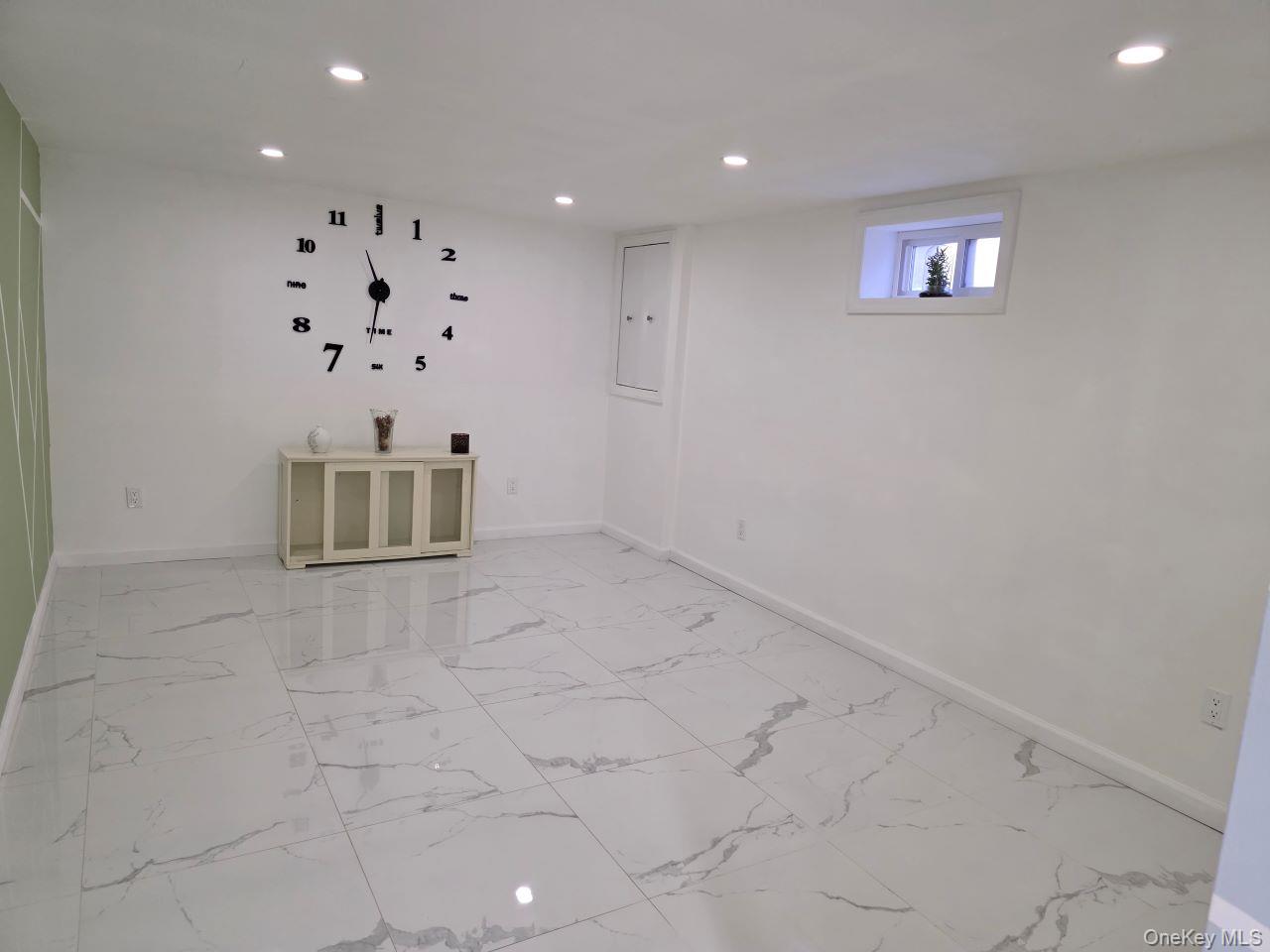 30 Aberdeen Road New Hyde Park, NY 11040 - Photo 24 of 37 an empty room with wall and windows