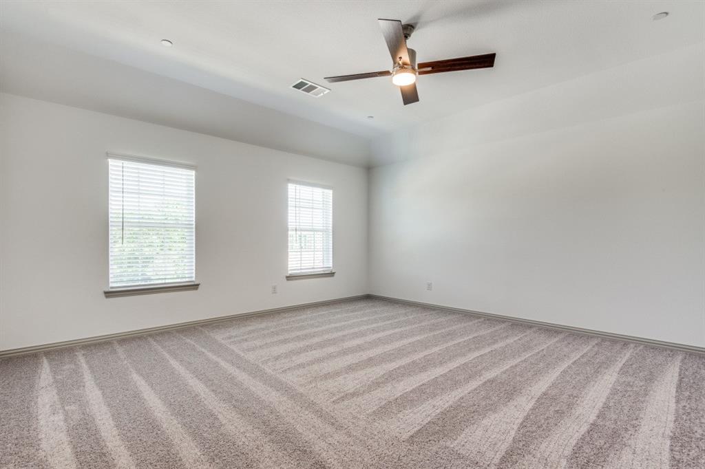 8913 Swallowtail Street Frisco, TX 75035 - Photo 24 of 38 an empty room with windows