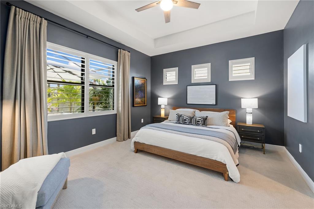 3967 Pegasus Way Naples, FL 34120 - Photo 13 of 50 a bedroom with a large bed and a window