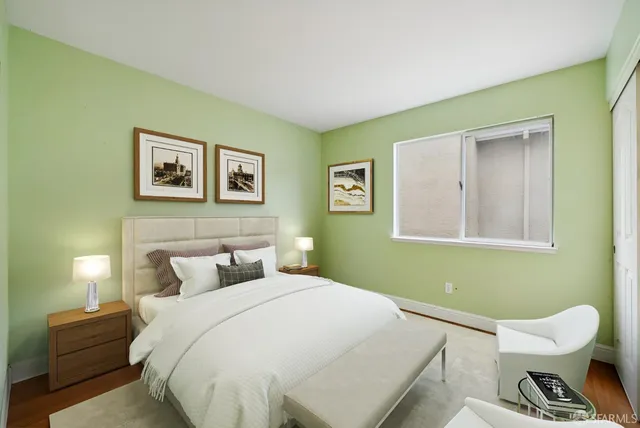 a view of a swimming pool with a yard and palm trees