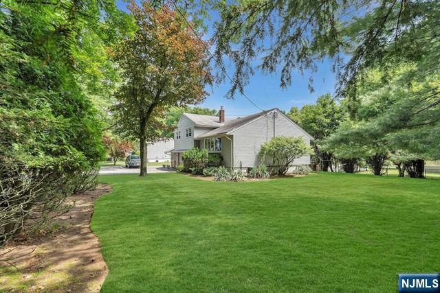 516 Knickerbocker Road Cresskill, NJ 07626 - Photo 28 of 31 a view of a big yard next to a house