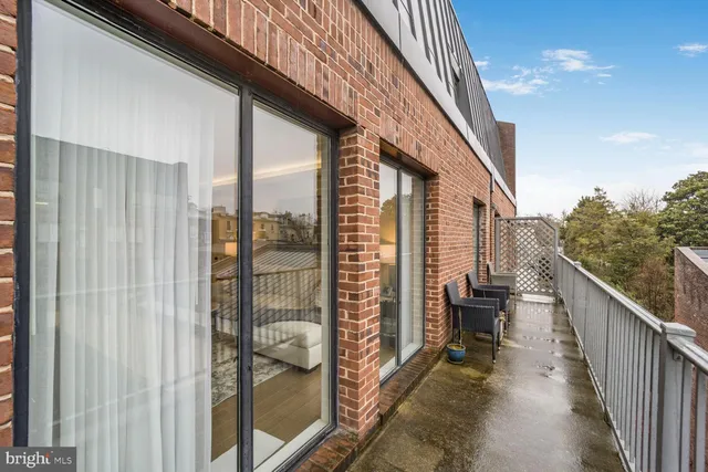 a view of balcony with furniture