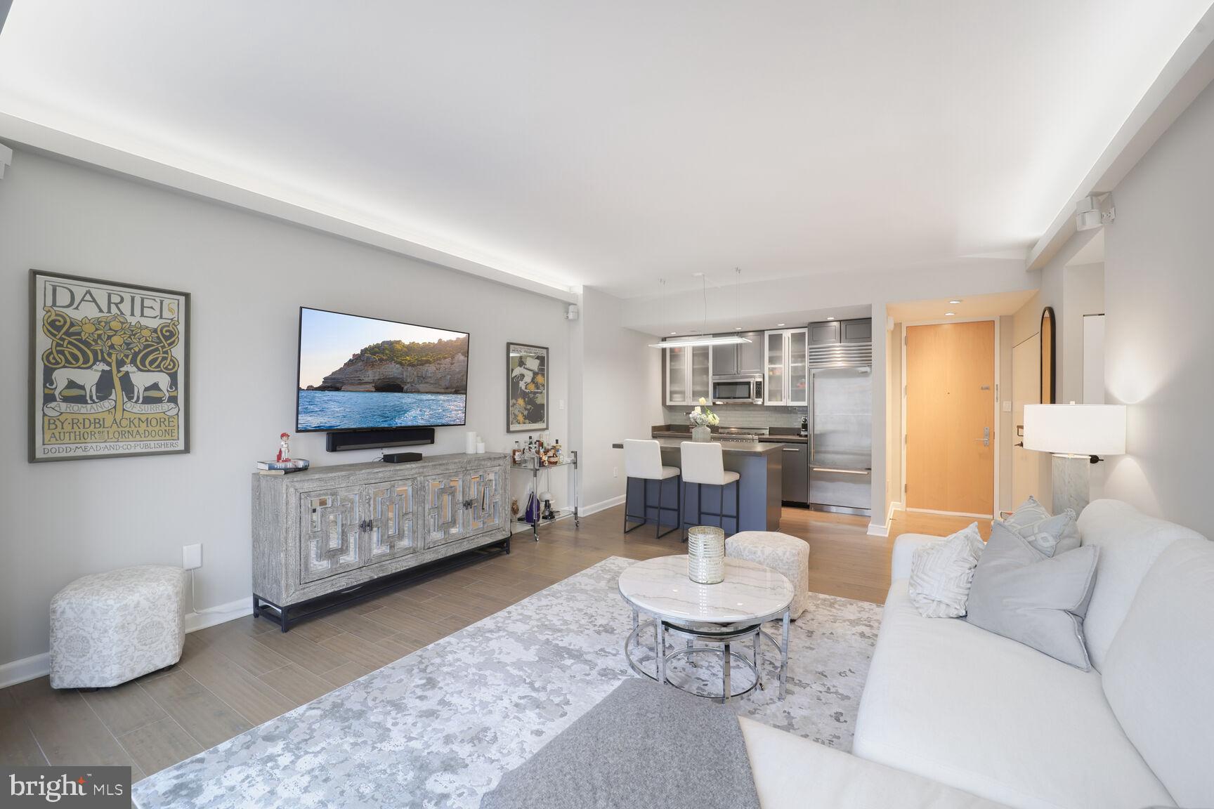 3251 Prospect Street Northwest, Unit 410 Washington, DC 20007 - Photo 4 of 16 a living room with furniture and a flat screen tv