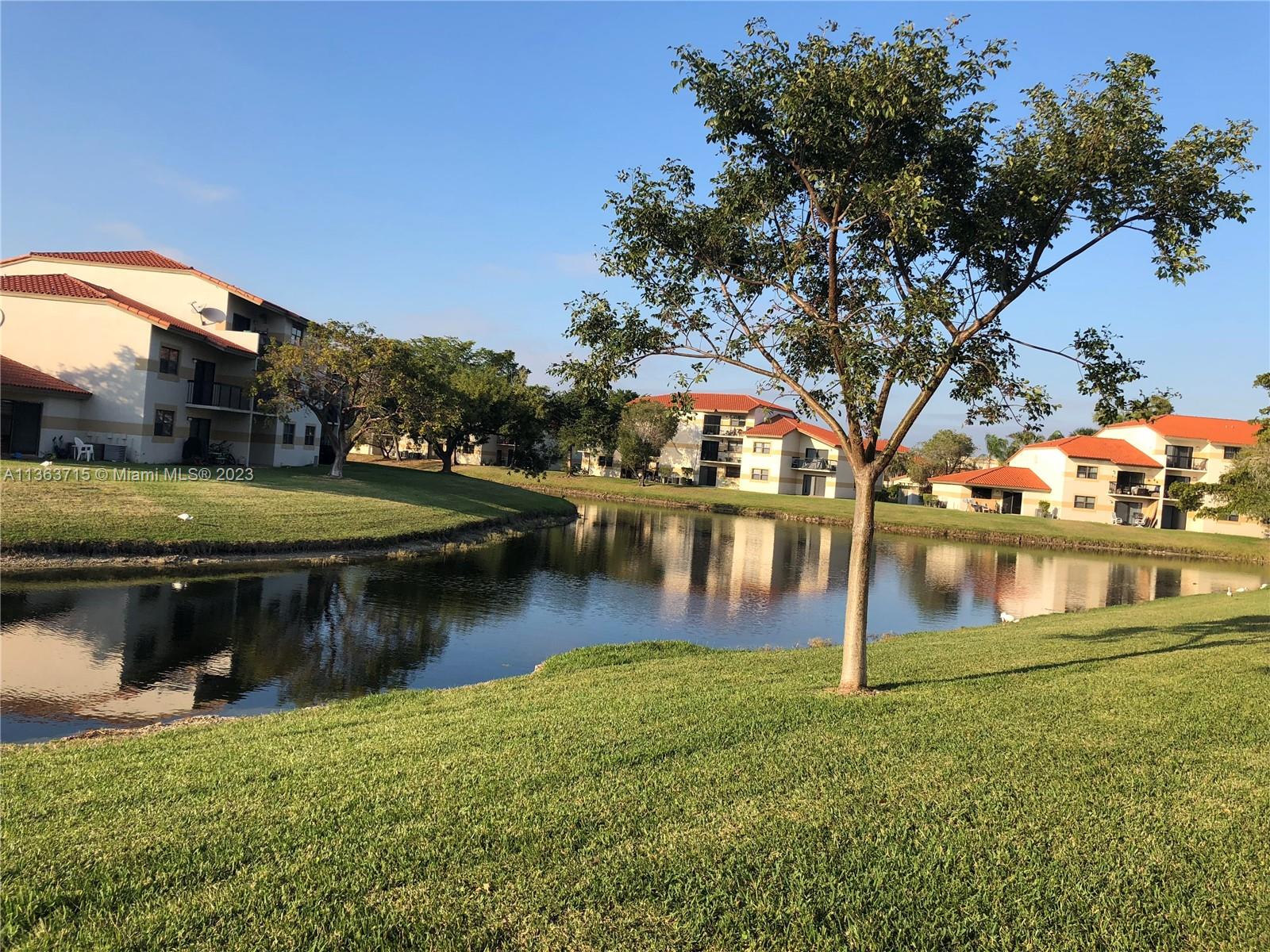 Welleby Sunrise, FL 33351 - Photo 11 of 13 a view of a lake with houses