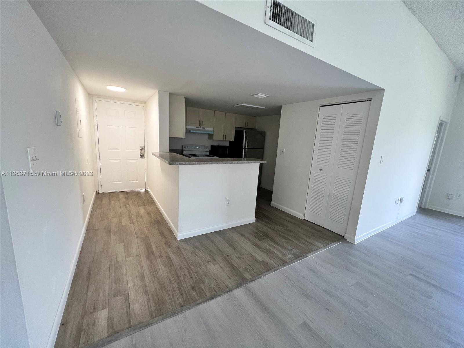 Welleby Sunrise, FL 33351 - Photo 13 of 13 a view of kitchen and wooden floor