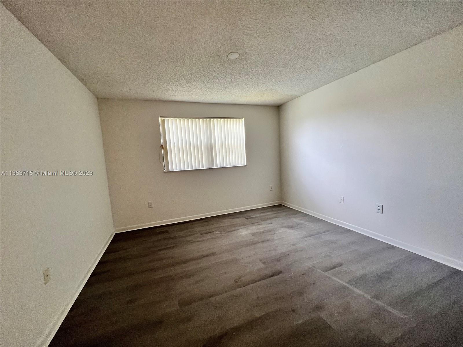 Welleby Sunrise, FL 33351 - Photo 5 of 13 an empty room with windows