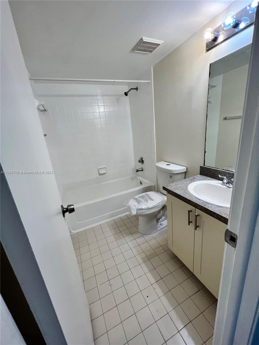 Welleby Sunrise, FL 33351 - Photo 6 of 13 a bathroom with a sink a toilet and shower