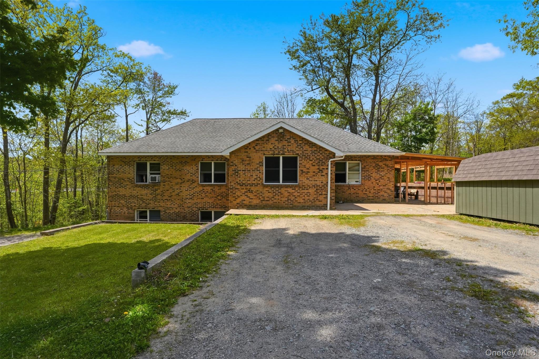 6 Short Road Wurtsboro, NY 12790 - Photo 3 of 48 a front view of a house with a yard and garage