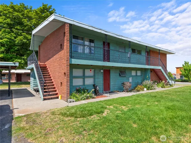 a view of a house with a yard porch and sitting area