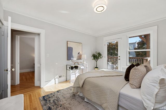 a bedroom with a bed and a couch