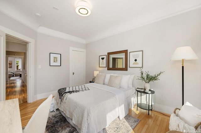 a bedroom with a bed and a couch