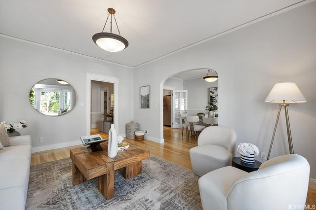 a living room with furniture and a table
