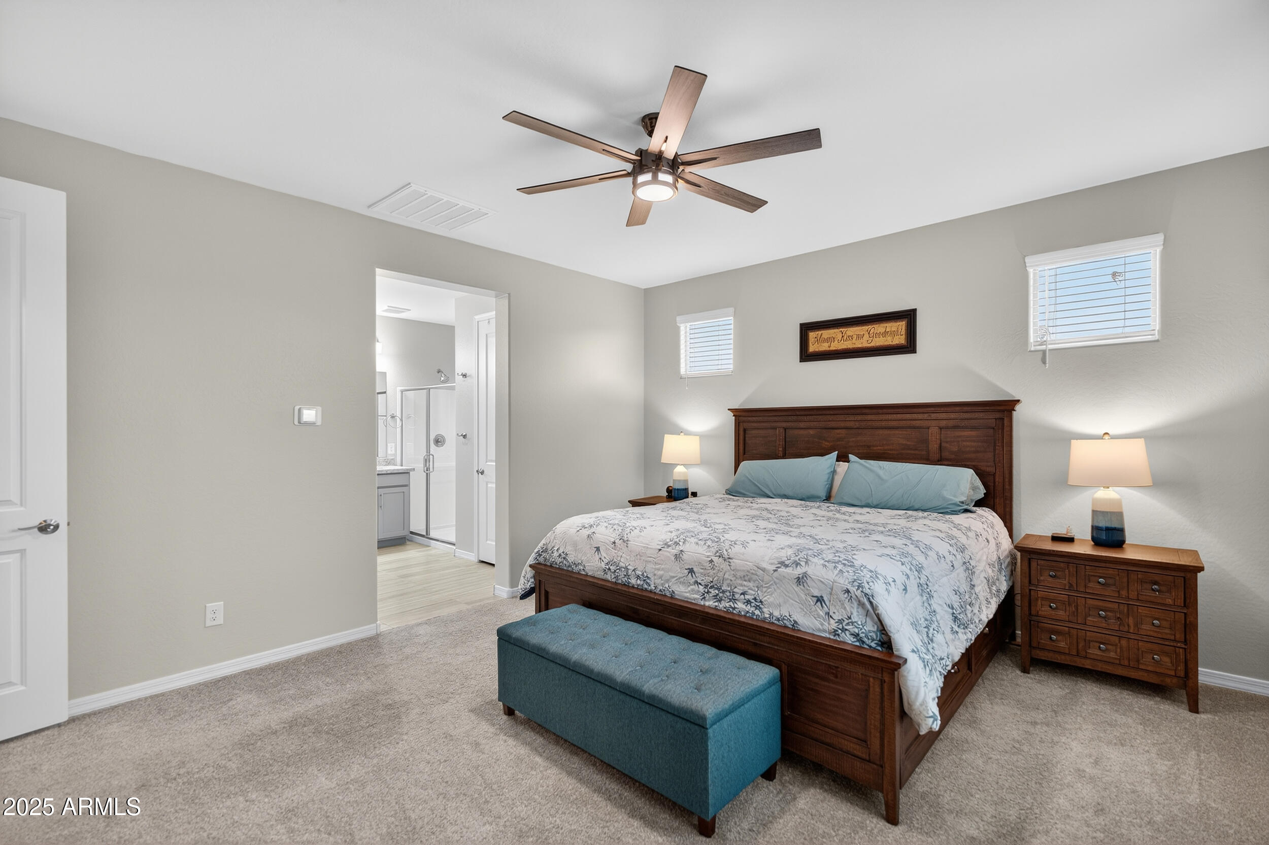 10218 West Piccadilly Road Avondale, AZ 85392 - Photo 12 of 28 a bedroom with a bed and ceiling fan
