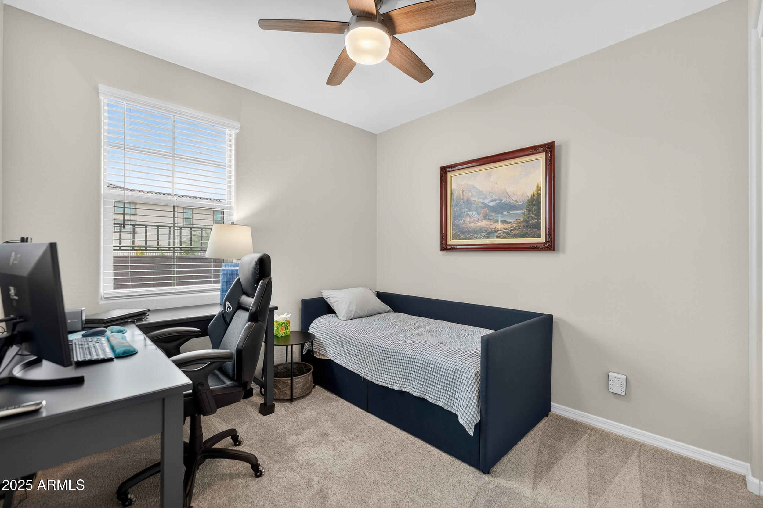 10218 West Piccadilly Road Avondale, AZ 85392 - Photo 15 of 28 a bedroom with a bed and a window