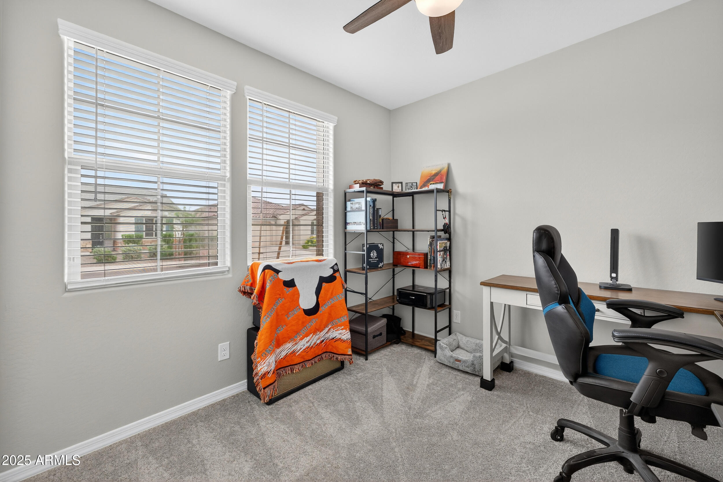 10218 West Piccadilly Road Avondale, AZ 85392 - Photo 20 of 28 a view of a workspace with furniture and a window