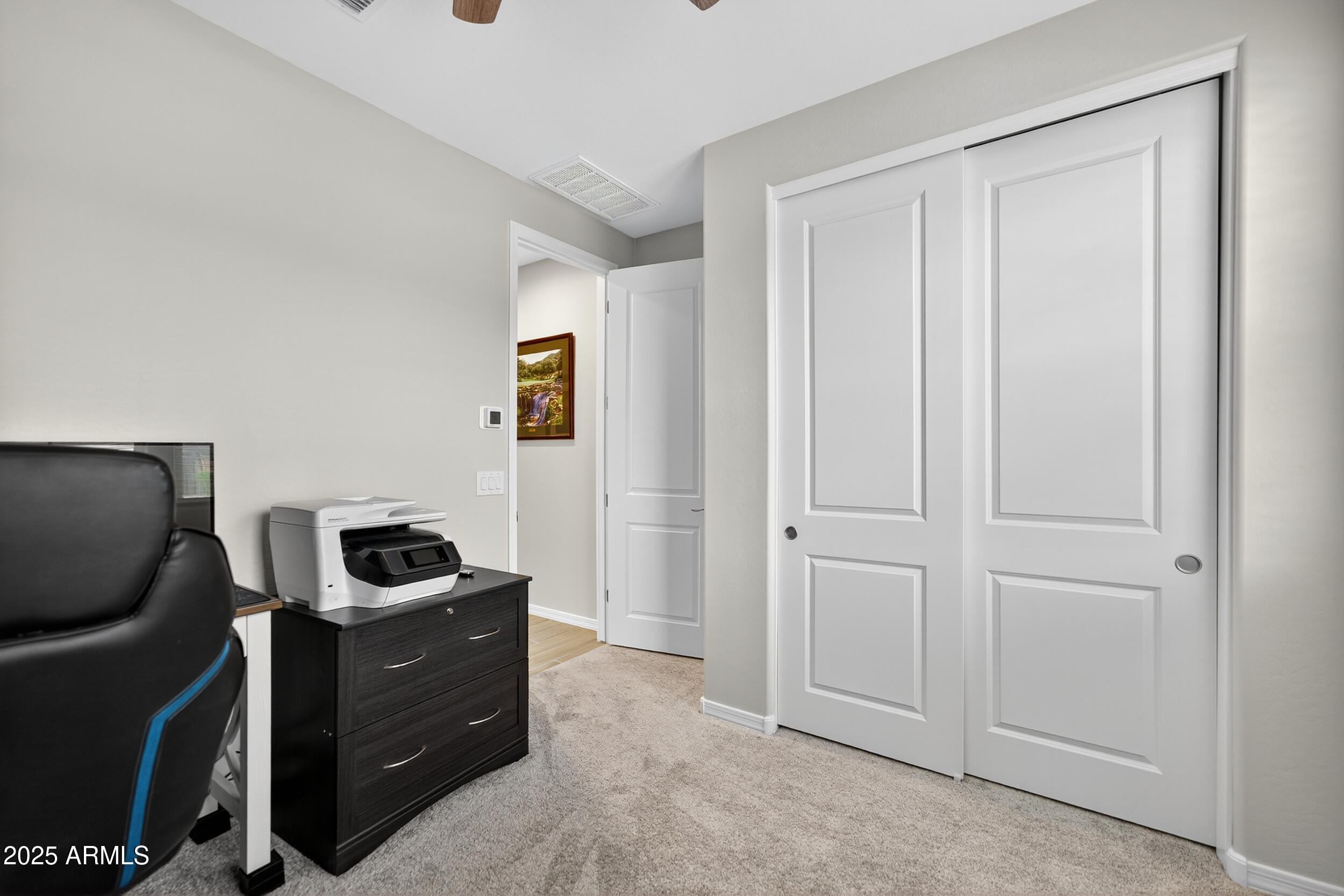 10218 West Piccadilly Road Avondale, AZ 85392 - Photo 21 of 28 a room that has a bed and a closet