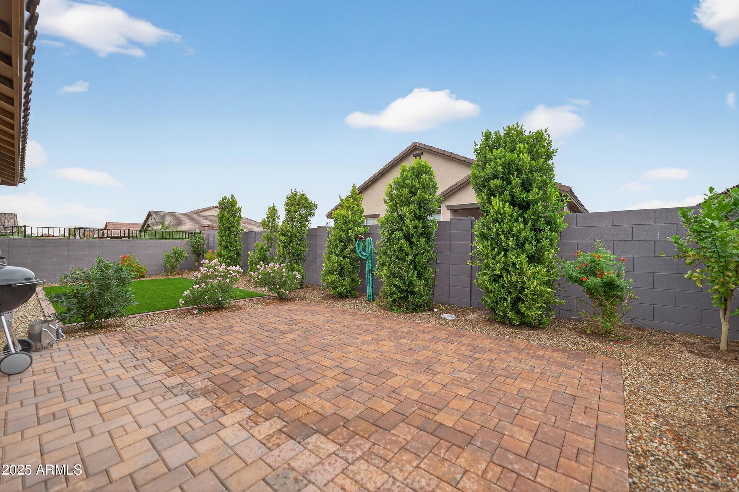 10218 West Piccadilly Road Avondale, AZ 85392 - Photo 26 of 28 a view of a garden with a building in the background