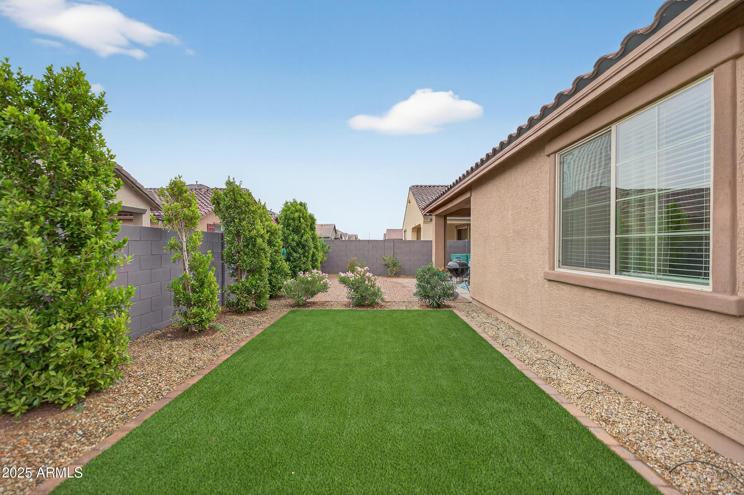 10218 West Piccadilly Road Avondale, AZ 85392 - Photo 28 of 28 a view of a backyard with plants and a garden