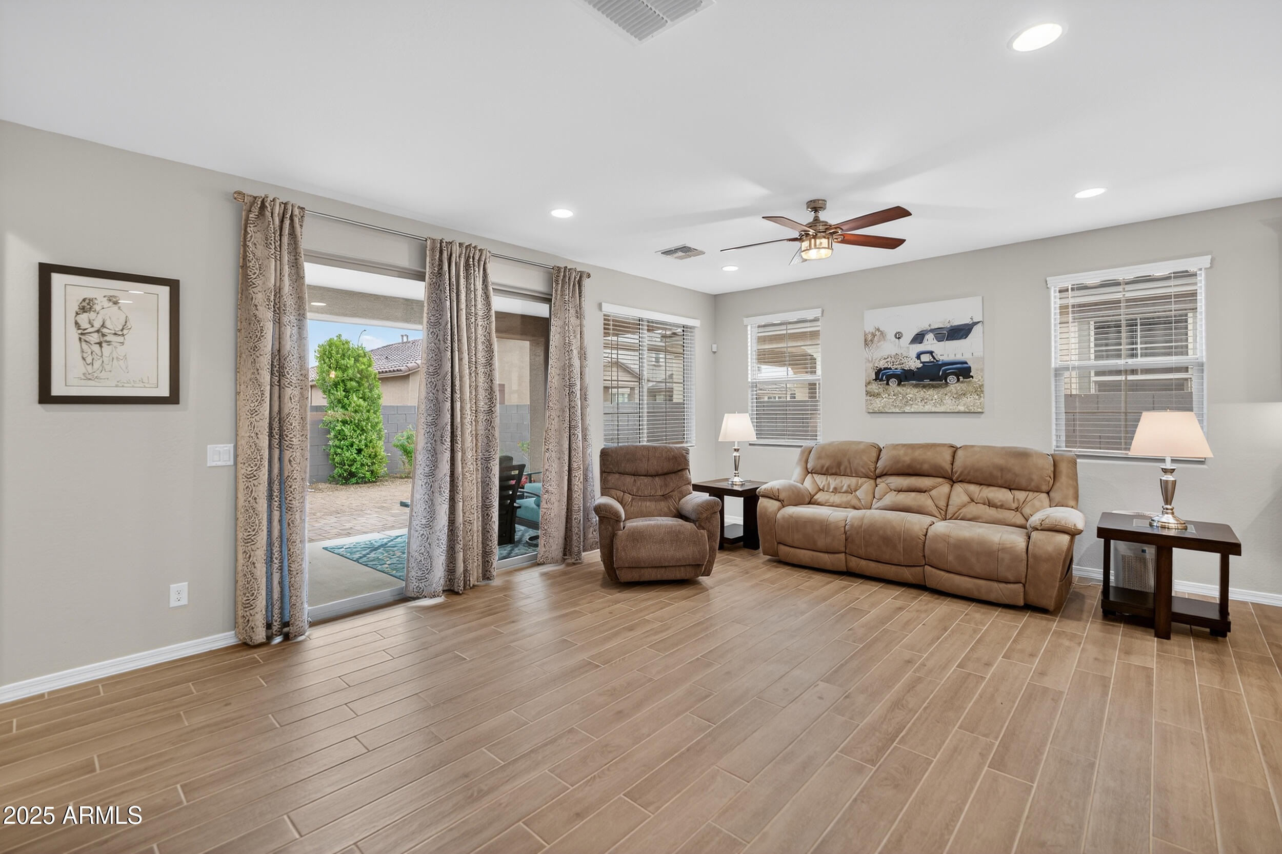 10218 West Piccadilly Road Avondale, AZ 85392 - Photo 3 of 28 a living room with furniture and a large window