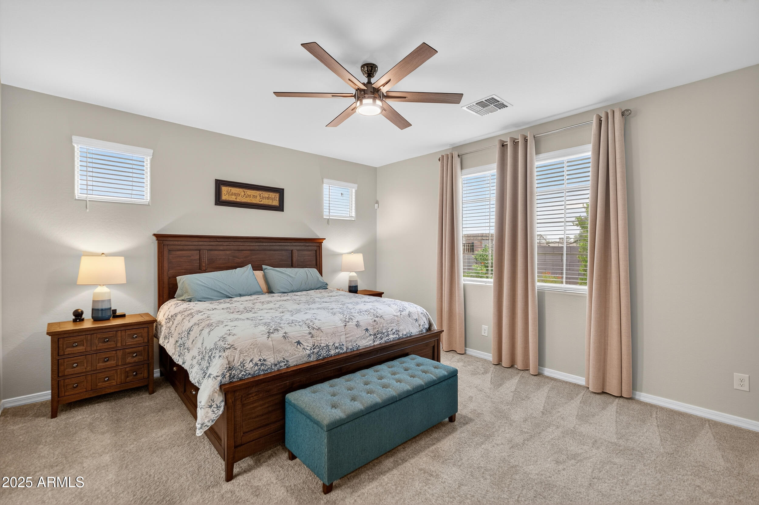 10218 West Piccadilly Road Avondale, AZ 85392 - Photo 4 of 28 a bedroom with a bed and window
