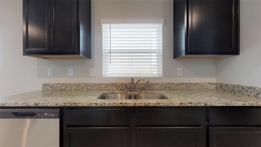 145 Weldon Road McDonough, GA 30253 - Photo 11 of 32 a kitchen with granite countertop a sink and a microwave