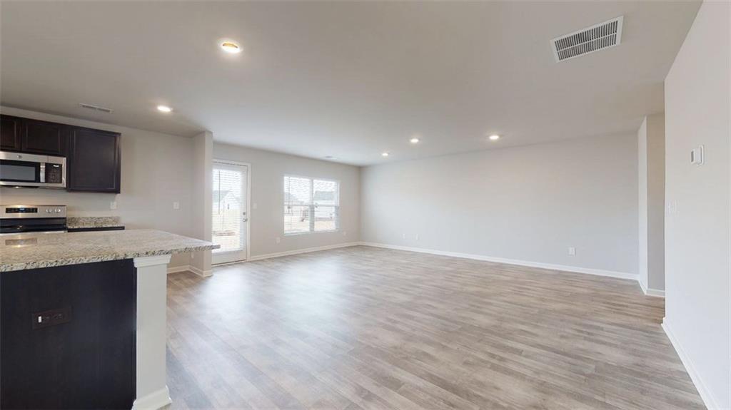 145 Weldon Road McDonough, GA 30253 - Photo 16 of 32 a view of a kitchen with a sink and a window