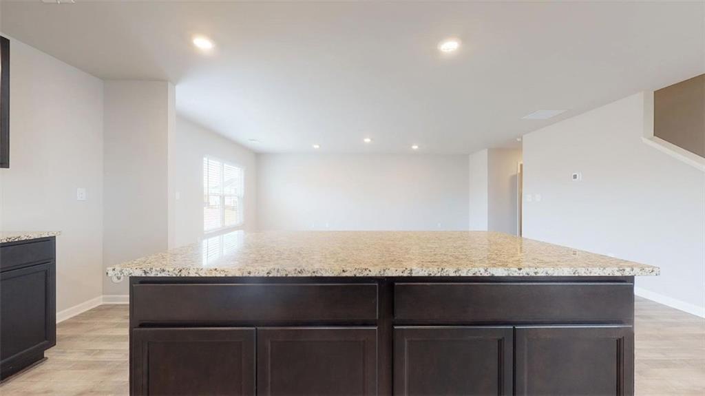 145 Weldon Road McDonough, GA 30253 - Photo 10 of 32 a bathroom with a granite countertop sink and a mirror