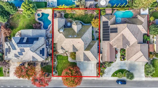 an aerial view of houses with outdoor space