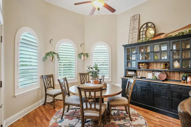 a dining room with furniture and window