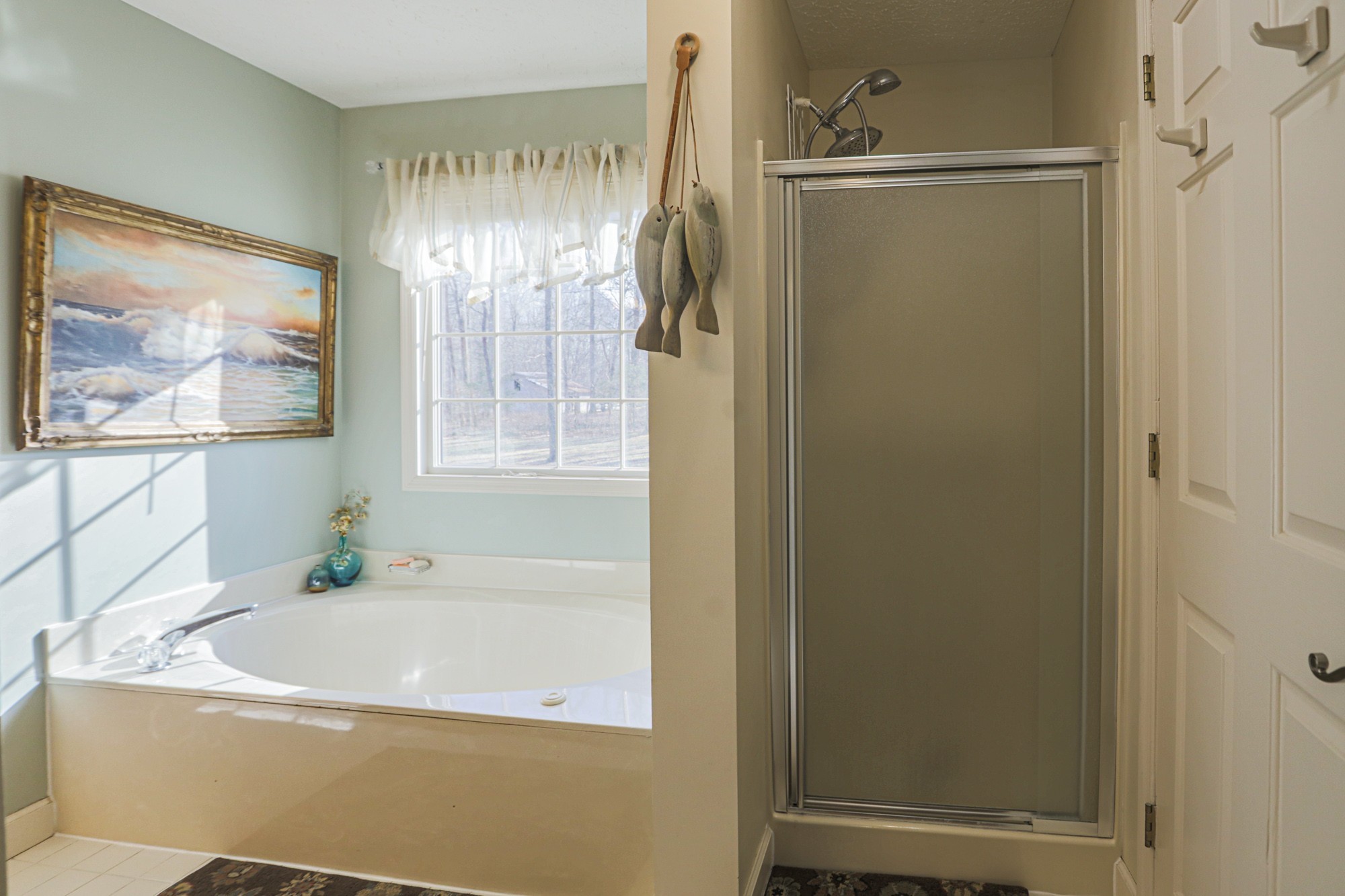 7126 Elrod Road Fairview, TN 37062 - Photo 25 of 36 a bathroom with a tub and shower