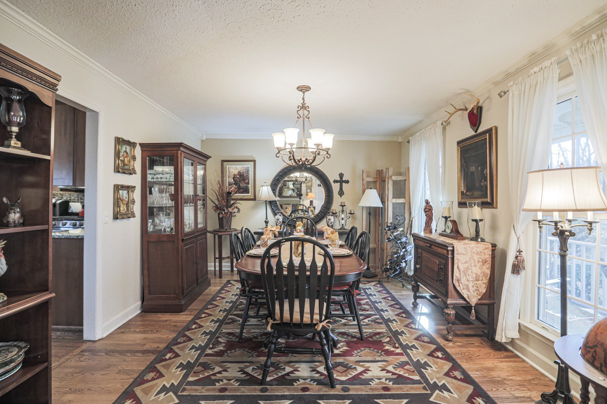 7126 Elrod Road Fairview, TN 37062 - Photo 26 of 36 a view of a dining room with furniture window and wooden floor